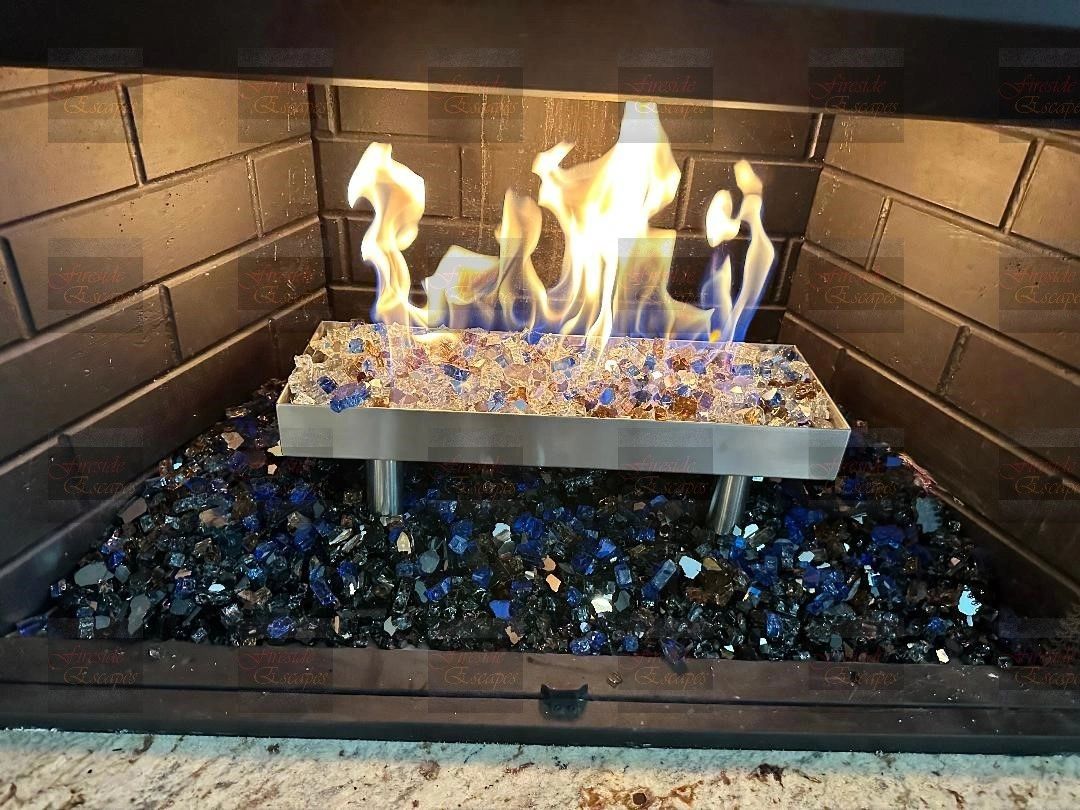 Fireglass burner inside a brick-lined fireplace from the Fireside Escapes gallery