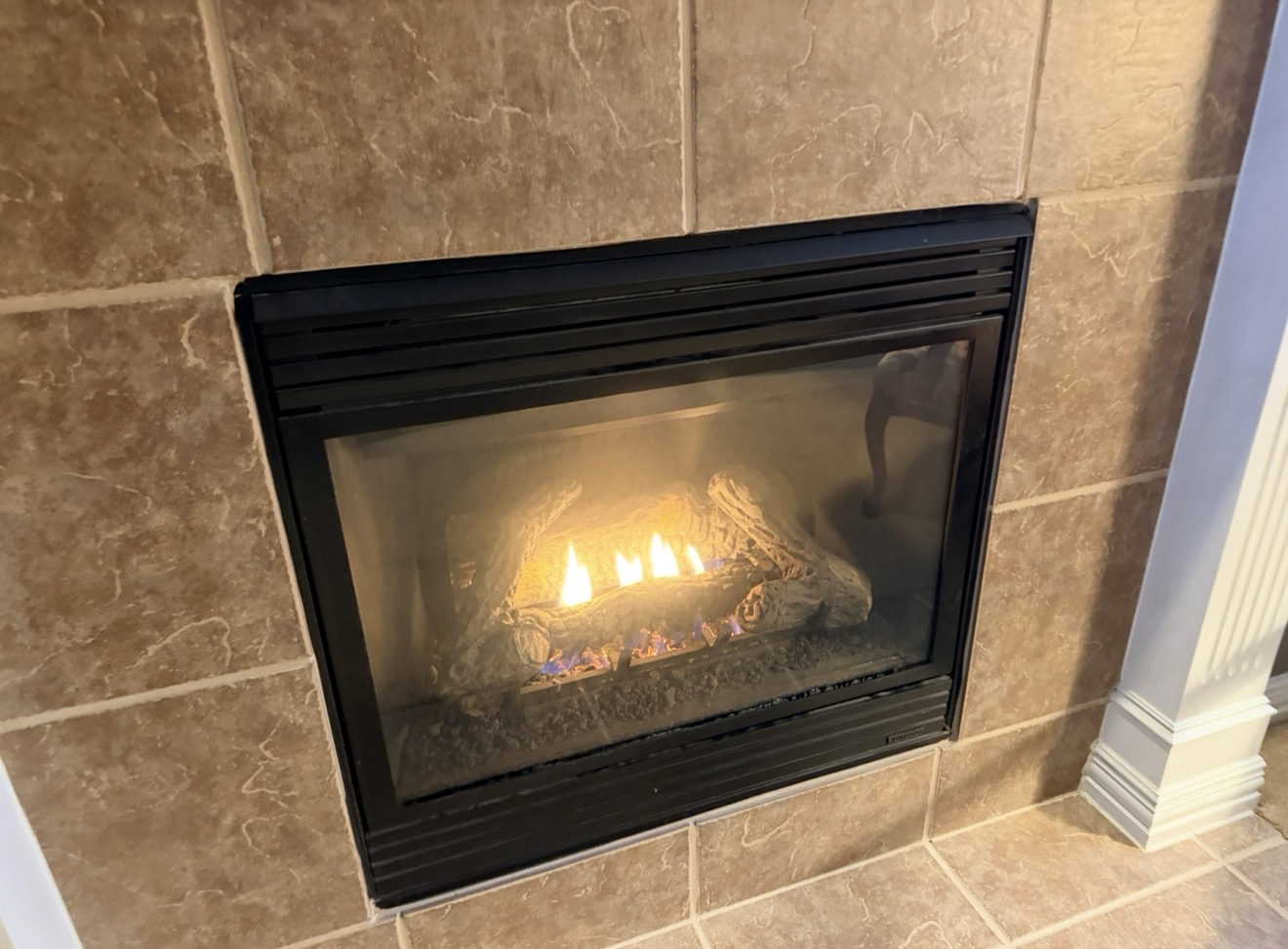 Direct-vent fireplace operating after repair and glass cleaning by Fireside Escapes in a Frisco home